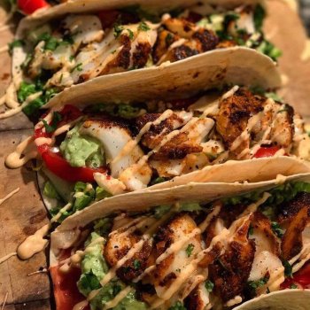 Loaded chicken tacos with lime and coriander